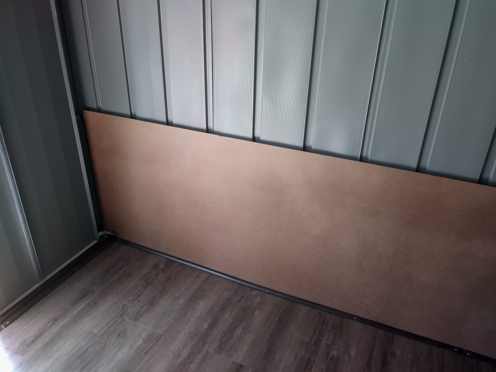 Interior protective paneling and vinyl plank flooring installed.